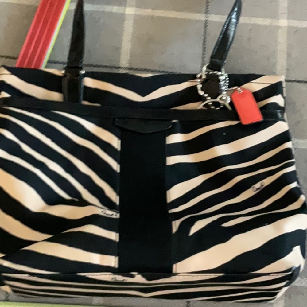 Very interesting coach bag zebra print very clean some cracks on handles no
